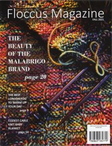 A multi-colored close-up of a knitted pattern covers the magazine and makes a rainbow background for the Floccus Magazine cover.